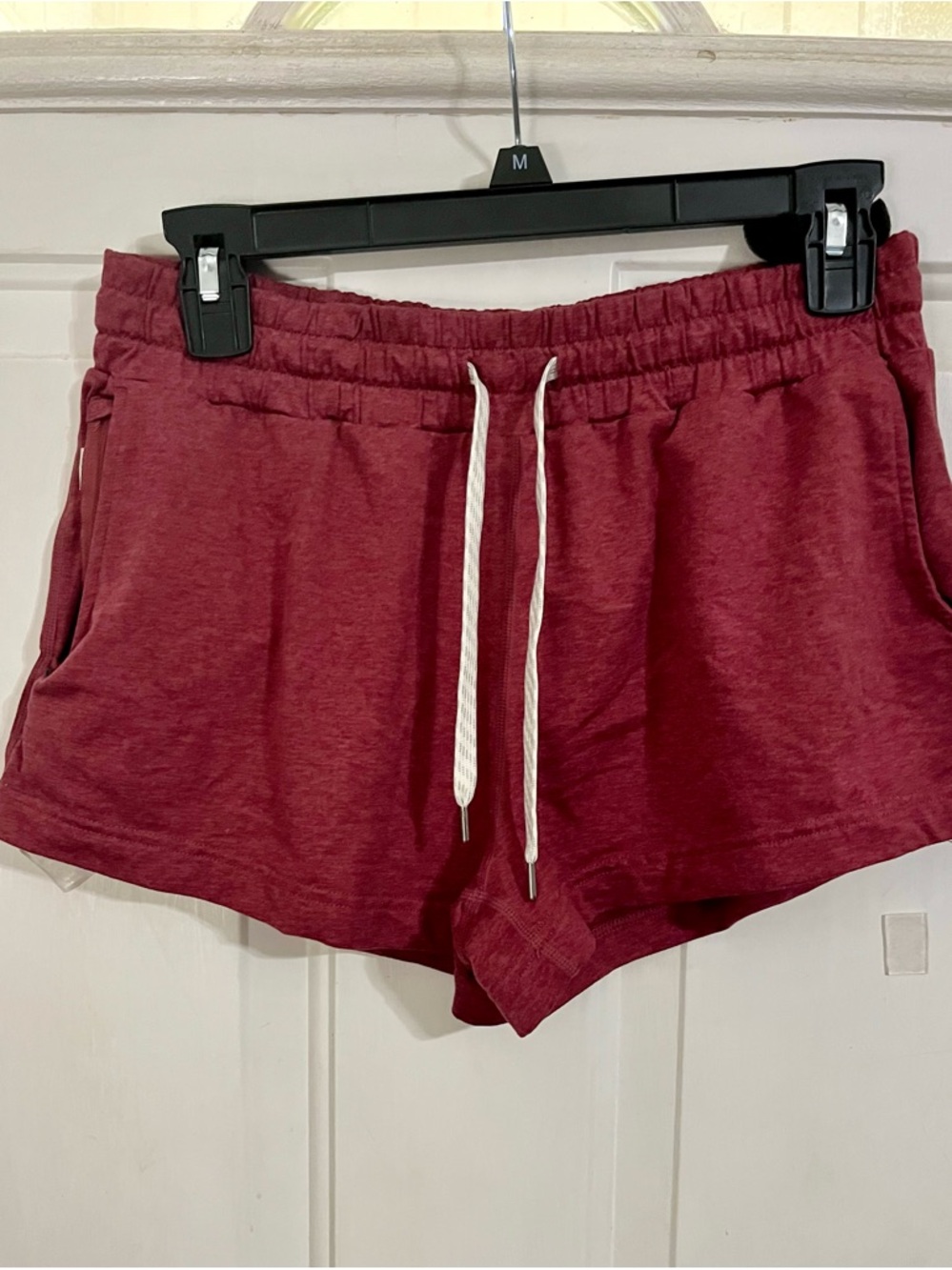 Vuori Women's Athletic Shorts in Burgundy with White Drawstring